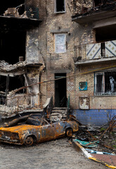 Buildings and car damaged by Russian bombs.