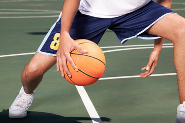 Man, legs and basketball on court for playing, training or workout with performance and wellness. Athlete, person or ball for sport, exercise or technique with fitness, skill and sports match outdoor - obrazy, fototapety, plakaty