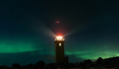 Majestic lighthouse atop a rocky cliffside, its beacon of light shining brightly over the landscape