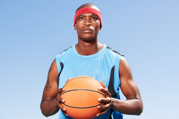 Confident, basketball player and outdoor portrait for sport, game and competition in summer with sky background. Serious, black man and exercise with ball, goals or fitness from playing and training - Powered by Adobe