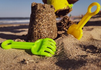 Closeup shot of beach tools for building sandcastle on the beach