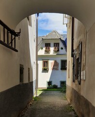 A view of a narrow quiet street in an old small town