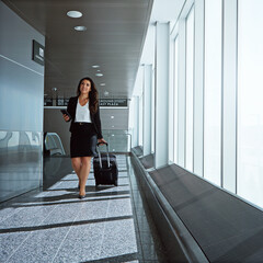 Walking, airport or businesswoman with phone, suitcase or luggage on social media or online. Travel, airplane or corporate lady texting to chat on mobile app on international flight transportation