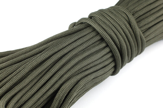 Olive-colored paracord cord. A skein of lace.