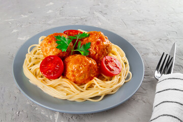 Tomato sauce-infused italian meatballs with pasta