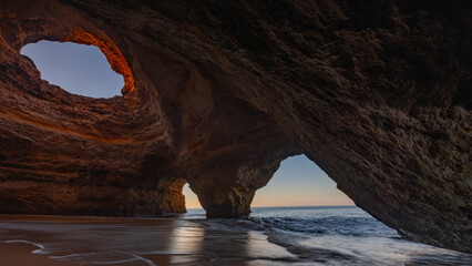 Spectacular sunset view of the Benagil Sea Cave in Algarve, Portugal, Europe