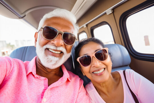 Happy Smiling Older Indian Tourist Couple Taking Selfie Inside Airplane. Tourism Concept, Holidays And Traveling Lifestyle.