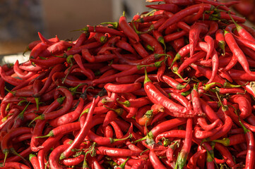 fresh appetizing red hot pepper at the bazaar on the island of Cyprus in autumn 2