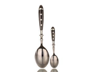 Two metal spoons, macro, isolated on white background.