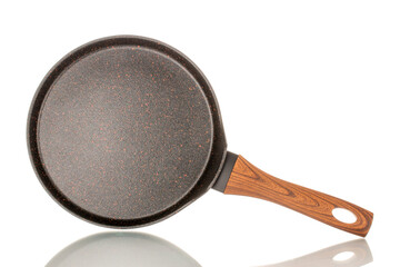 One metal pancake pan, macro, isolated on white background.
