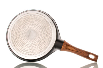 One metal pancake pan, macro, isolated on white background.