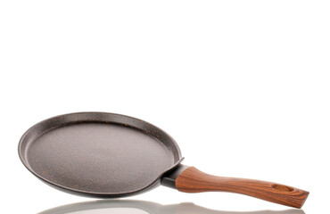 One metal pancake pan, macro, isolated on white background.