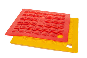 Naklejka premium Two silicone pot holders, macro, isolated on white background.