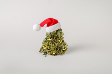 Cannabis bud in the shape of a Christmas tree. Creative Christmas concept - 676921542