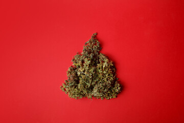 Cannabis bud in the shape of a Christmas tree. Creative Christmas concept