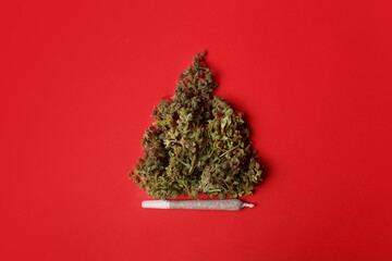 Cannabis bud in the shape of a Christmas tree. Creative Christmas concept