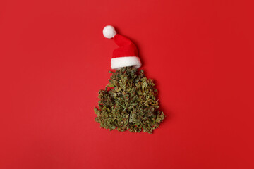 Cannabis bud in the shape of a Christmas tree. Creative Christmas concept - obrazy, fototapety, plakaty