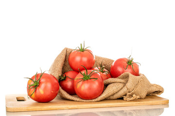 Several pink juicy tomatoes in a jute bag, macro, isolated on white background.