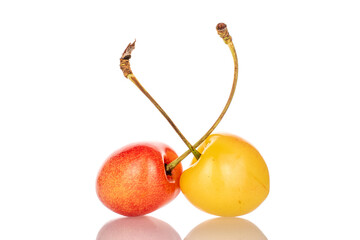 Two ripe cherries, macro, isolated on white background.