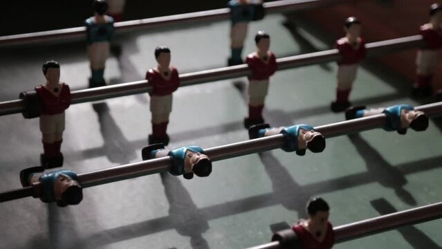 Closeup of a table football under a light