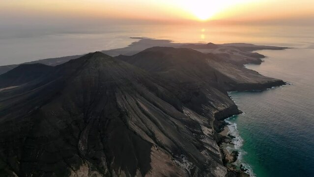 Volcanic hills and Atlantic Ocean. Cofete beach, Parque Natural Jandia. Fuerteventura, Canary Islands, Spain.