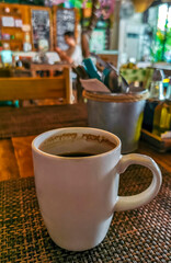 Cup of americano black coffee in restaurant cafe in Mexico.