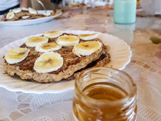 pancakes with banana topping and syrup
