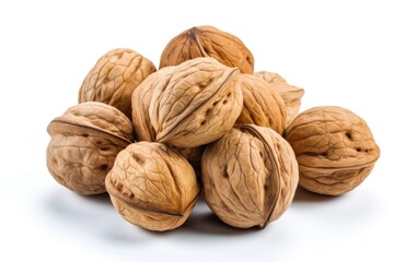 A pile of walnuts sitting on top of each other.