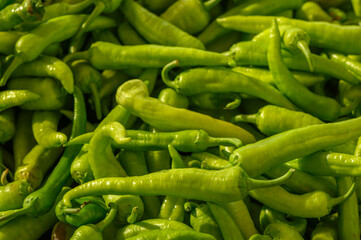 fresh appetizing green hot peppers at the bazaar on the island of Cyprus in autumn 2