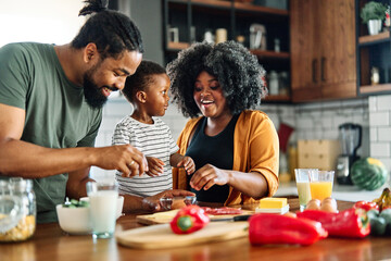 child family kitchen food boy son mother father breakfast preparing egg morning healthy diet eating home black african american father cooking, parent, cute, meal - obrazy, fototapety, plakaty