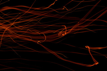 light ribbons of sparks on a black background, long exposure