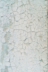 Old peeling paint on the wall. Abstract background.