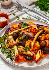baked winter veggies and mushrooms on a plate