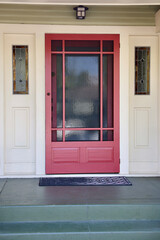 1920s vintage cottage with screen door and stained glass