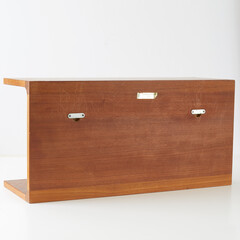 Mid-Century Modern teak wall shelf. 1960s minimalist bookshelf. Detail photograph.