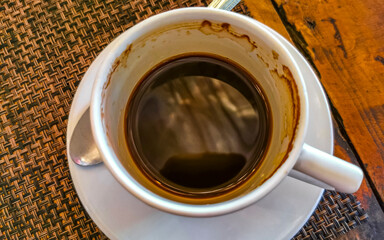 Cup of americano black coffee in restaurant cafe in Mexico.