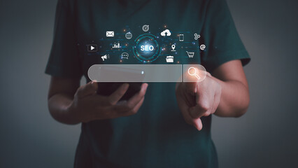 SEO Search Engine Optimization concept. Business people use smartphones with social media content and advertisements for promoting ranking traffic, optimizing their websites to rank in search engines.