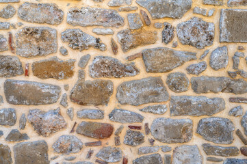 Graue Natursteinmauer als Steintextur mit Freiraum f&uuml;r individuelle Anpassungen