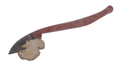 Grey modelling clay sculpture with modelling tool isolated on white, clipping path  