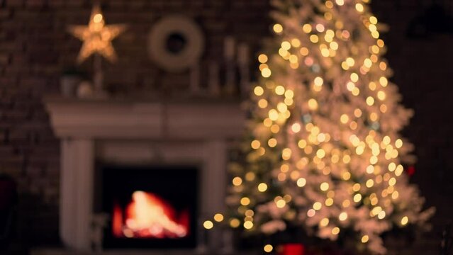 Christmas Tree In Cosy Decorated Living Room At Home With Fireplace. December Winter Mood. Blurred Out Of Focus Background Video For Holiday Ads And Offer.