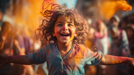 A happy child, a girl at the Holi festival