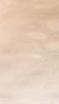 Beige brown gradient milk liquid surface beauty care background loop. Concept 3D animation vertical smooth water motion backplate. Cleansing hydration concept and body care product showcase backdrop.
