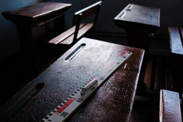 A metric ruler on a desk from another era, made of wood, vintage.