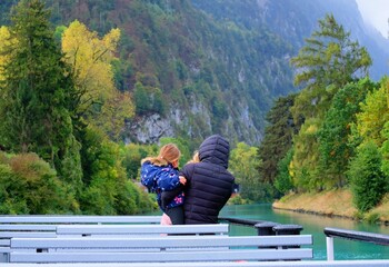 A woman embracing her little darling on a boat trip routes from Interlaken west heading toward Thun...