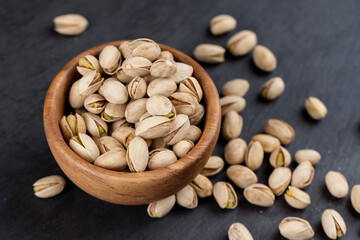 a large number of salty and crispy pistachios close-up