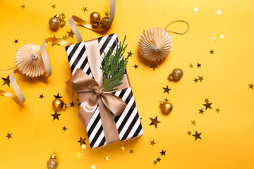 Gifts  and christmas decorations  on yellow  background. Christmas New Year background.