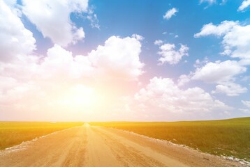 Empty road through the fields on a sunny day