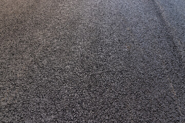 a close-up of a part of a new paved road
