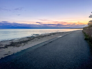 Nairn, Scotland - September 24, 2023: VIews along the water's edge at sunrise in the seaside town of Nairn, Scotland
