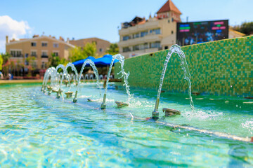 The trickles of the city fountain. Background with selective focus and copy space